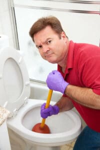 A SLC man doing plumbing maintenence in his home