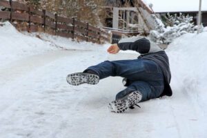 A person falling on an icy driveway
